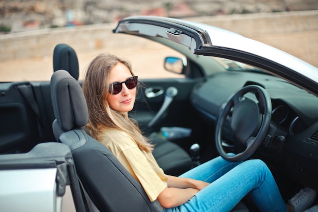 girl in a convertible car